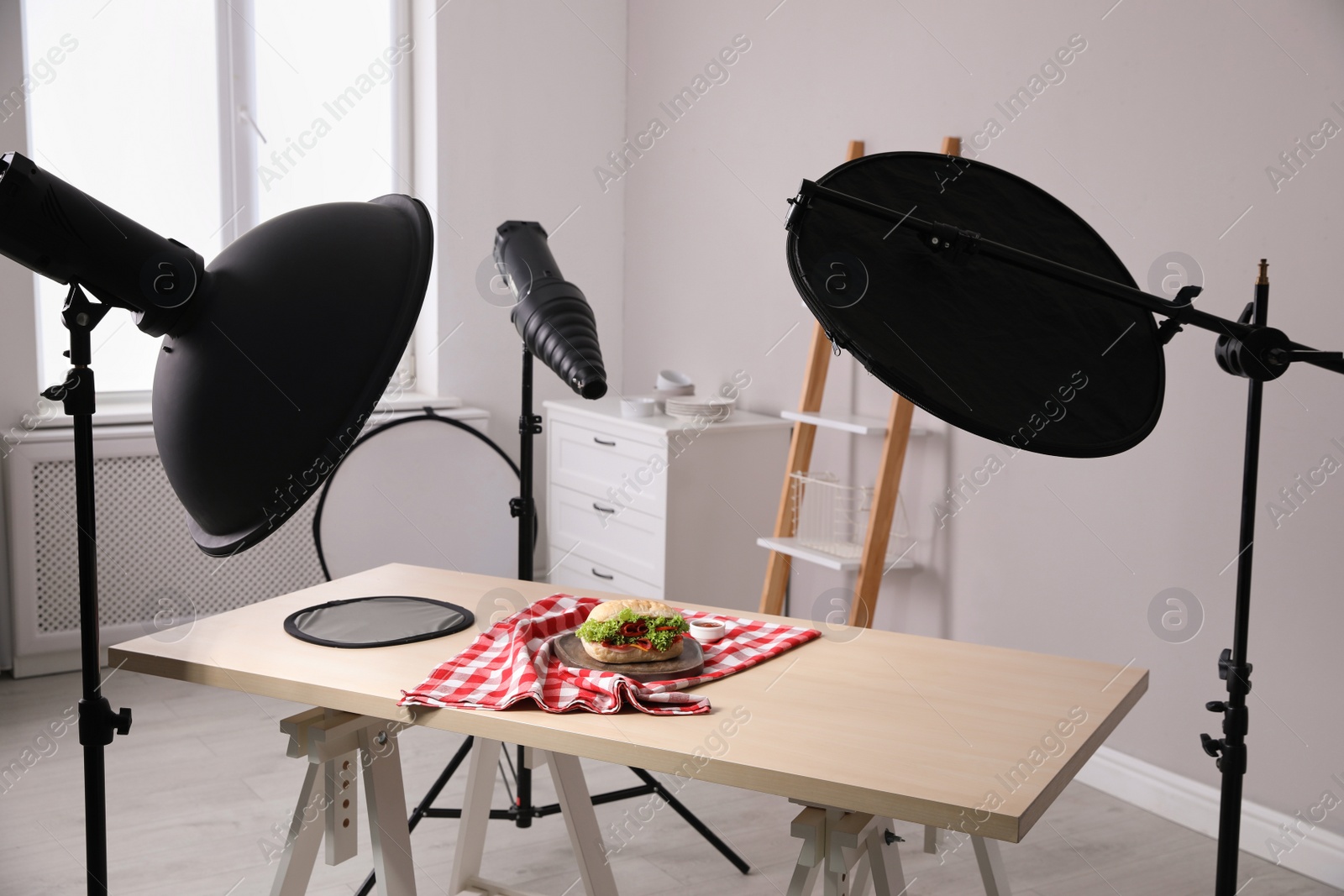 Photo of Composition with tasty sandwich on table in photo studio. Food photography