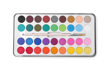 Photo of Watercolor palette with brush isolated on white, top view