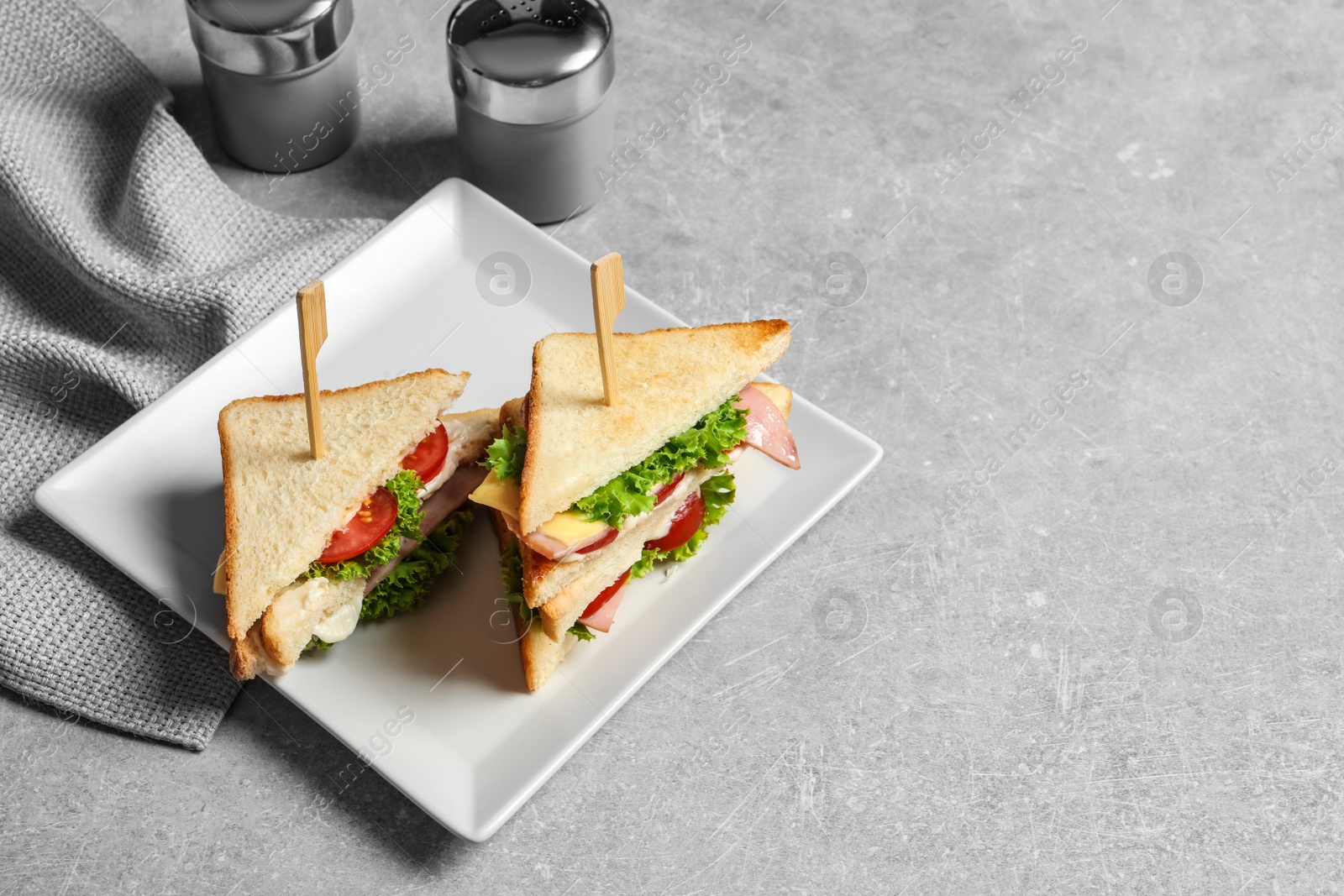 Photo of Tasty toast sandwiches on plate. Wheat bread