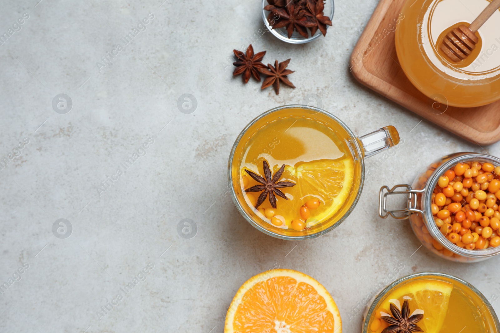 Photo of Flat lay composition with immunity boosting drink on grey table, space for text