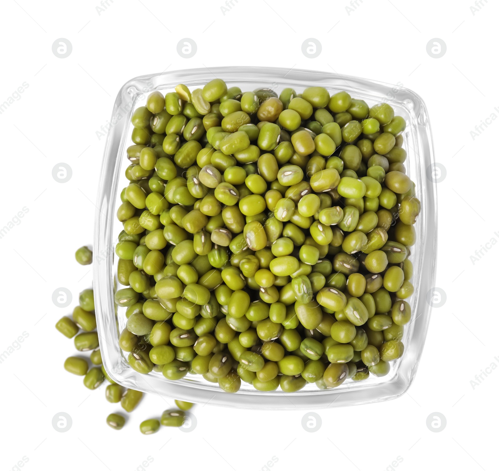 Photo of Glass bowl with green mung beans isolated on white, top view. Organic grains