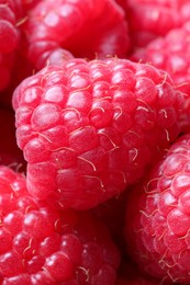 Many fresh ripe raspberries as background, closeup