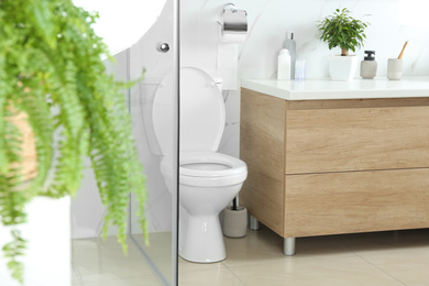 Photo of Stylish toilet bowl in modern bathroom interior