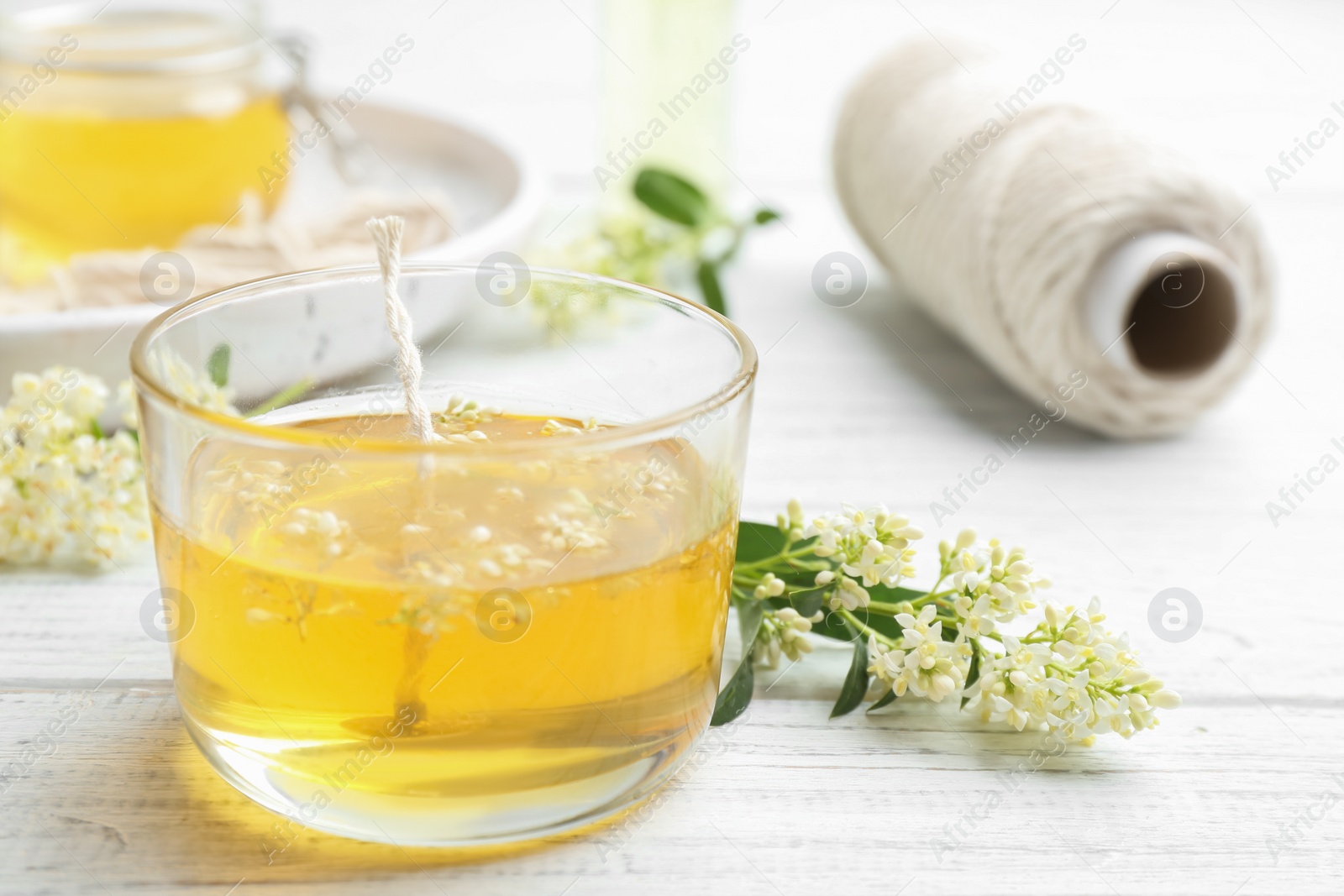 Photo of Process of making candle on wooden background