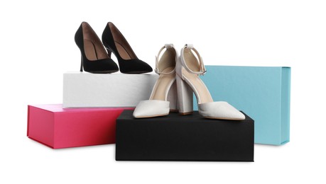 Stylish shoes and boxes on white background