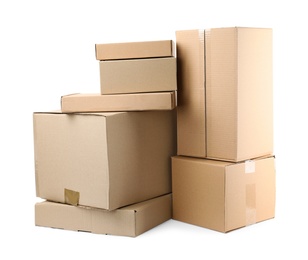 Photo of Pile of cardboard boxes on white background