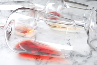 Glasses with red wine on marble background, closeup