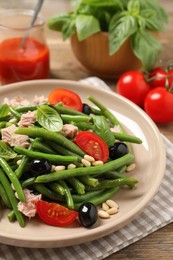 Tasty salad with green beans on table