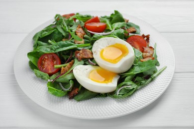 Photo of Delicious salad with boiled egg, bacon and tomatoes on white wooden table, closeup