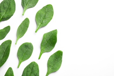 Photo of Fresh green healthy spinach leaves on white background, top view