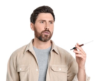 Photo of Man using cigarette holder for smoking isolated on white