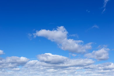 Picturesque blue sky with white clouds on sunny day