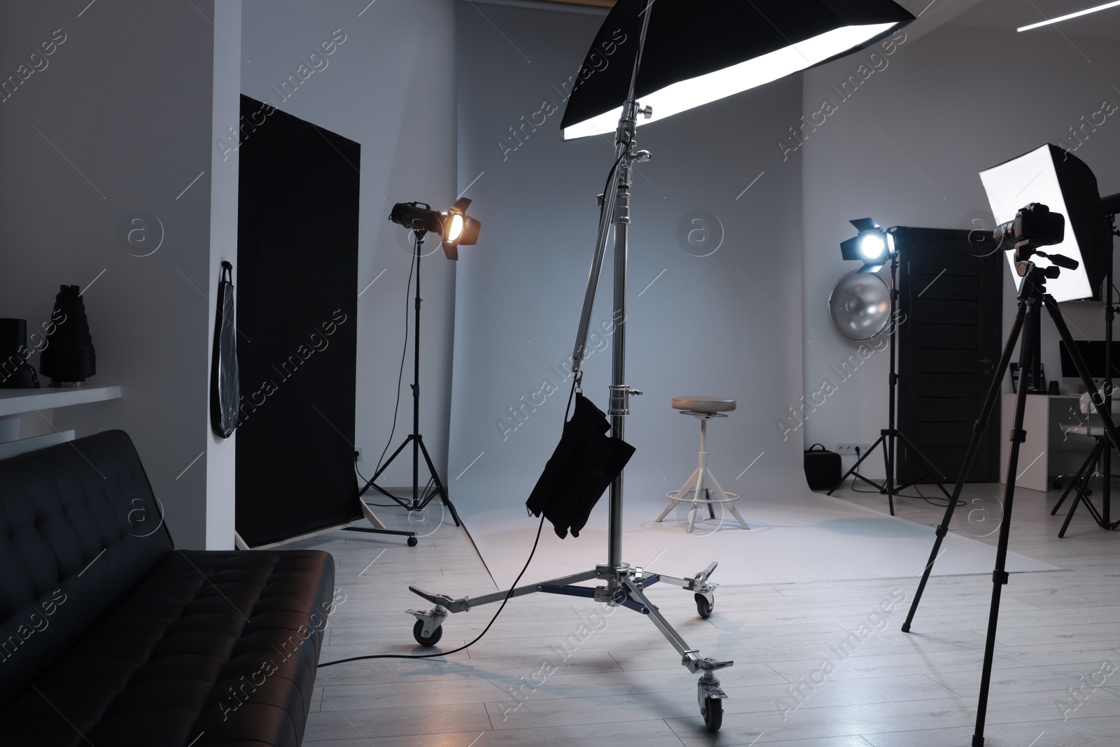 Photo of Casting call. Chair and different equipment in modern studio