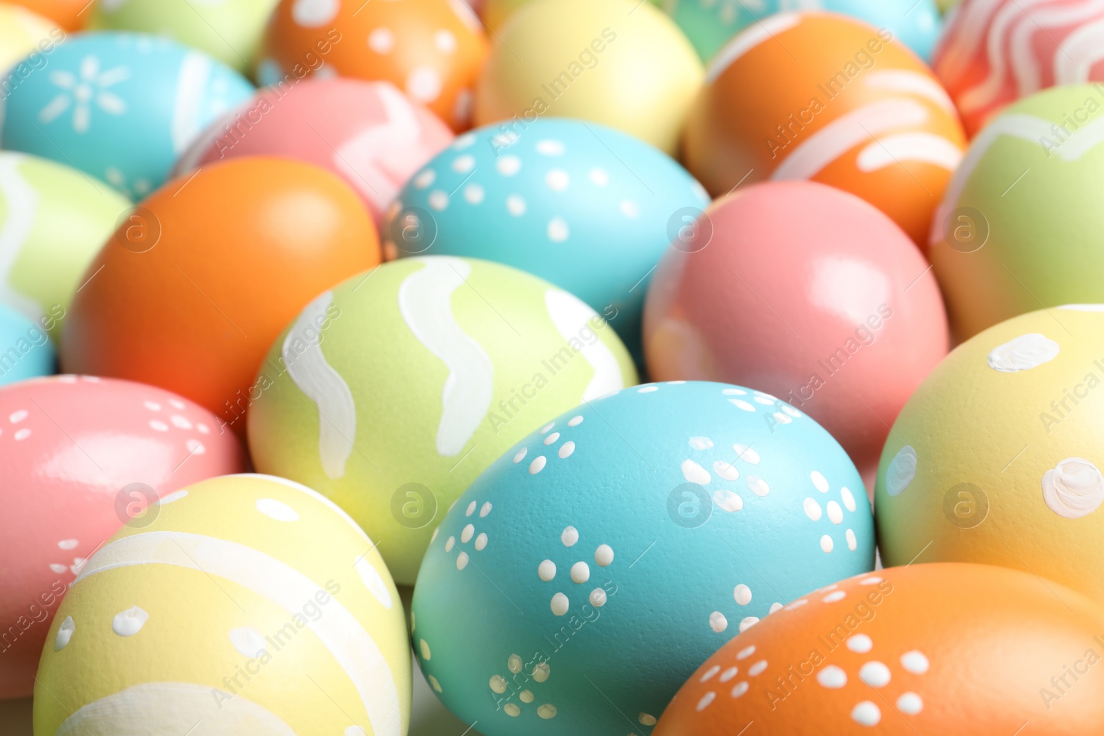 Photo of Many beautiful painted Easter eggs as background, closeup