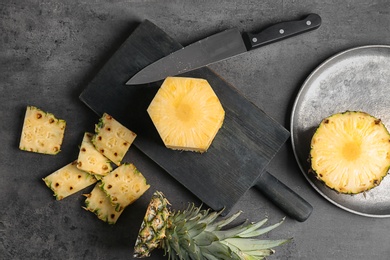 Cut fresh pineapple on wooden board