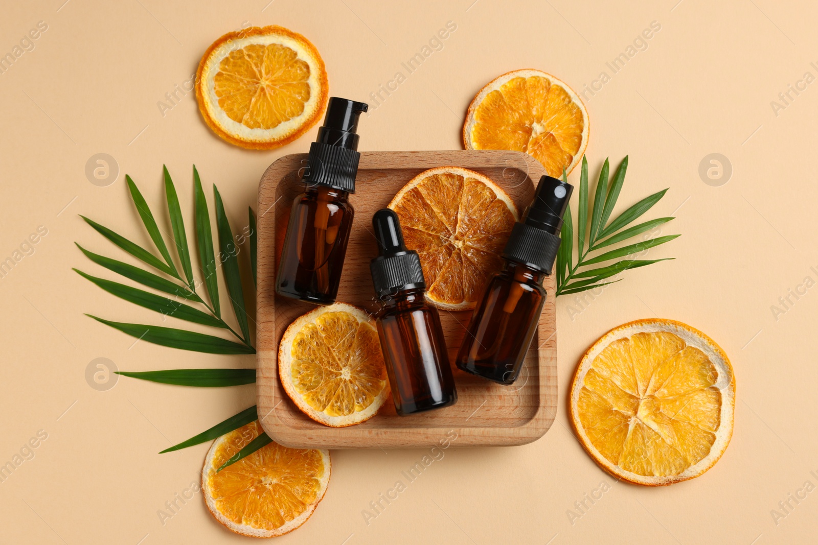 Photo of Flat lay composition with bottles of organic cosmetic products on beige background