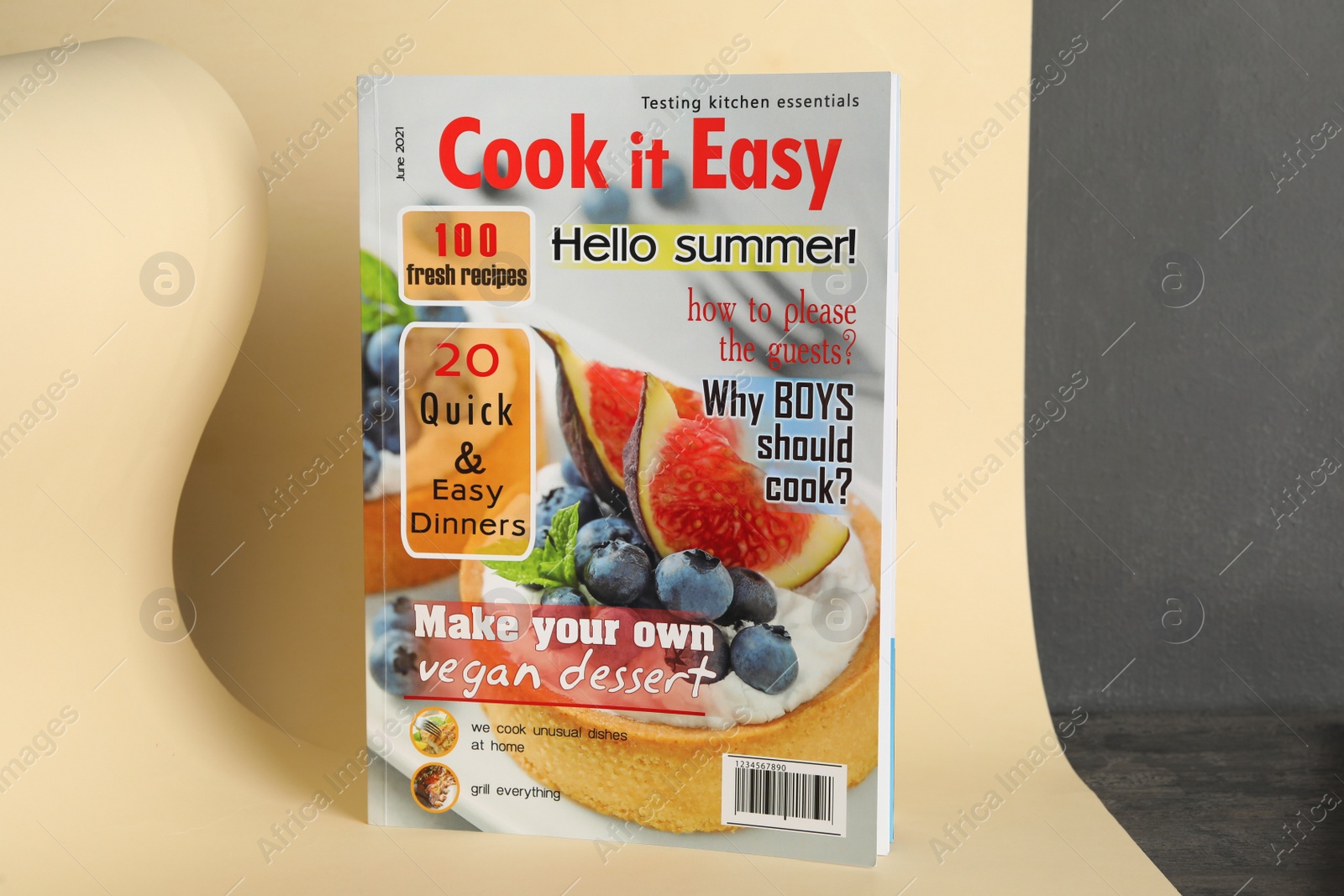 Photo of Modern printed culinary magazine on yellow background