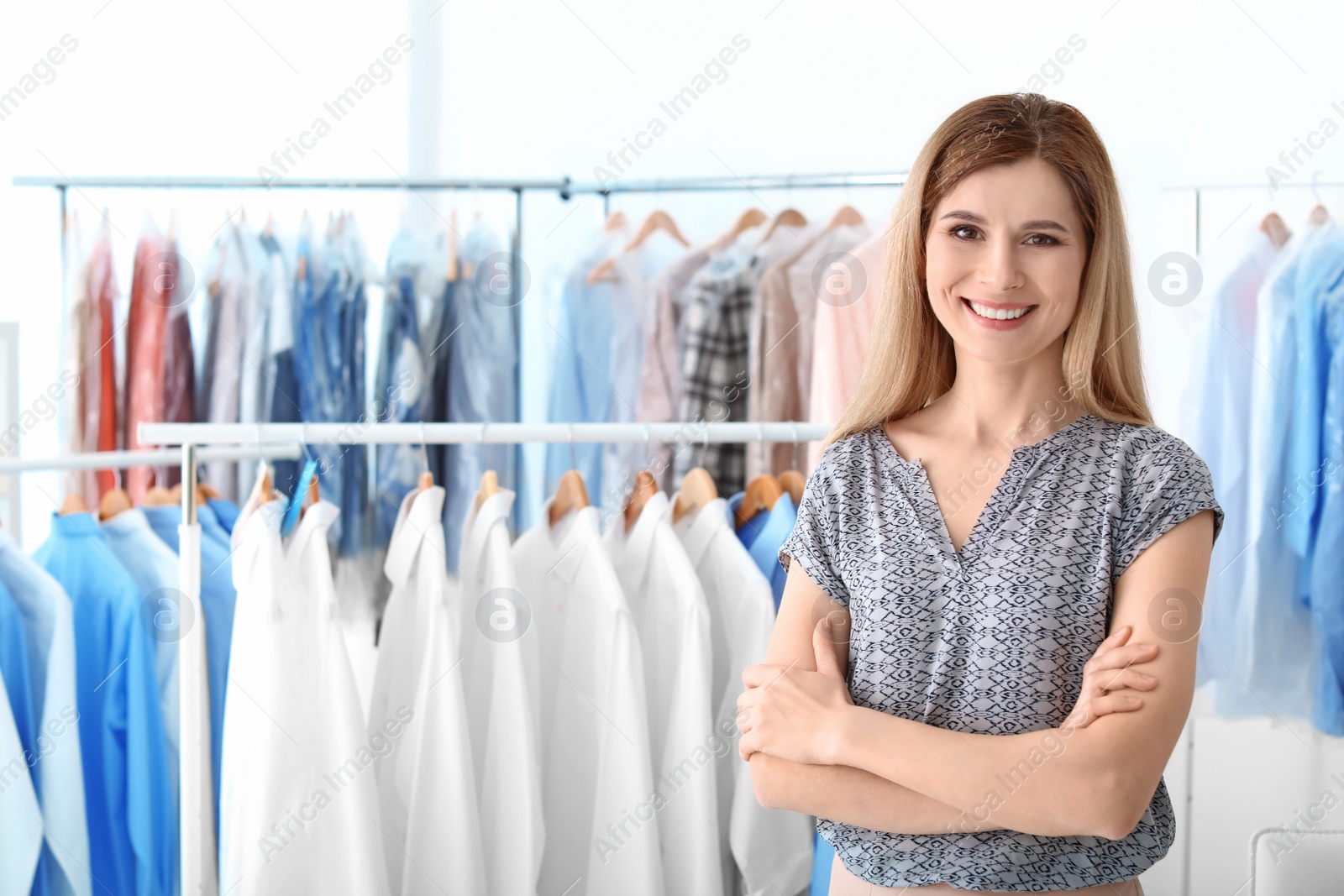 Photo of Portrait of dry-cleaner's employee at workplace