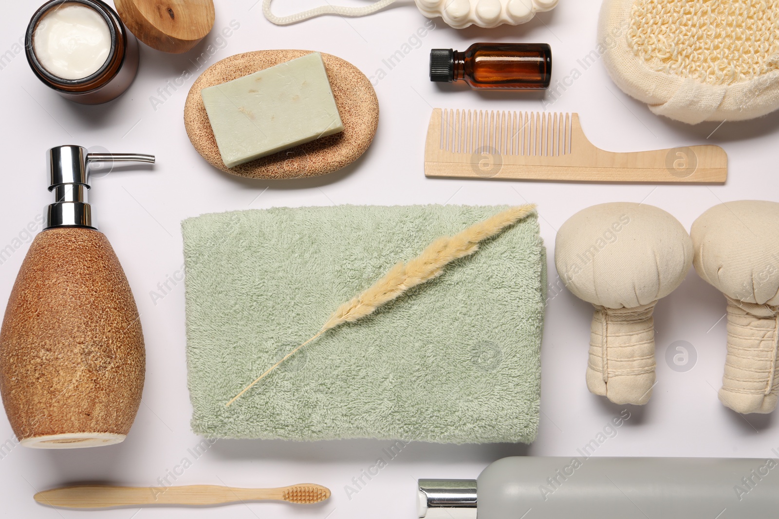 Photo of Bath accessories. Different personal care products and dry spikelet on white background, flat lay