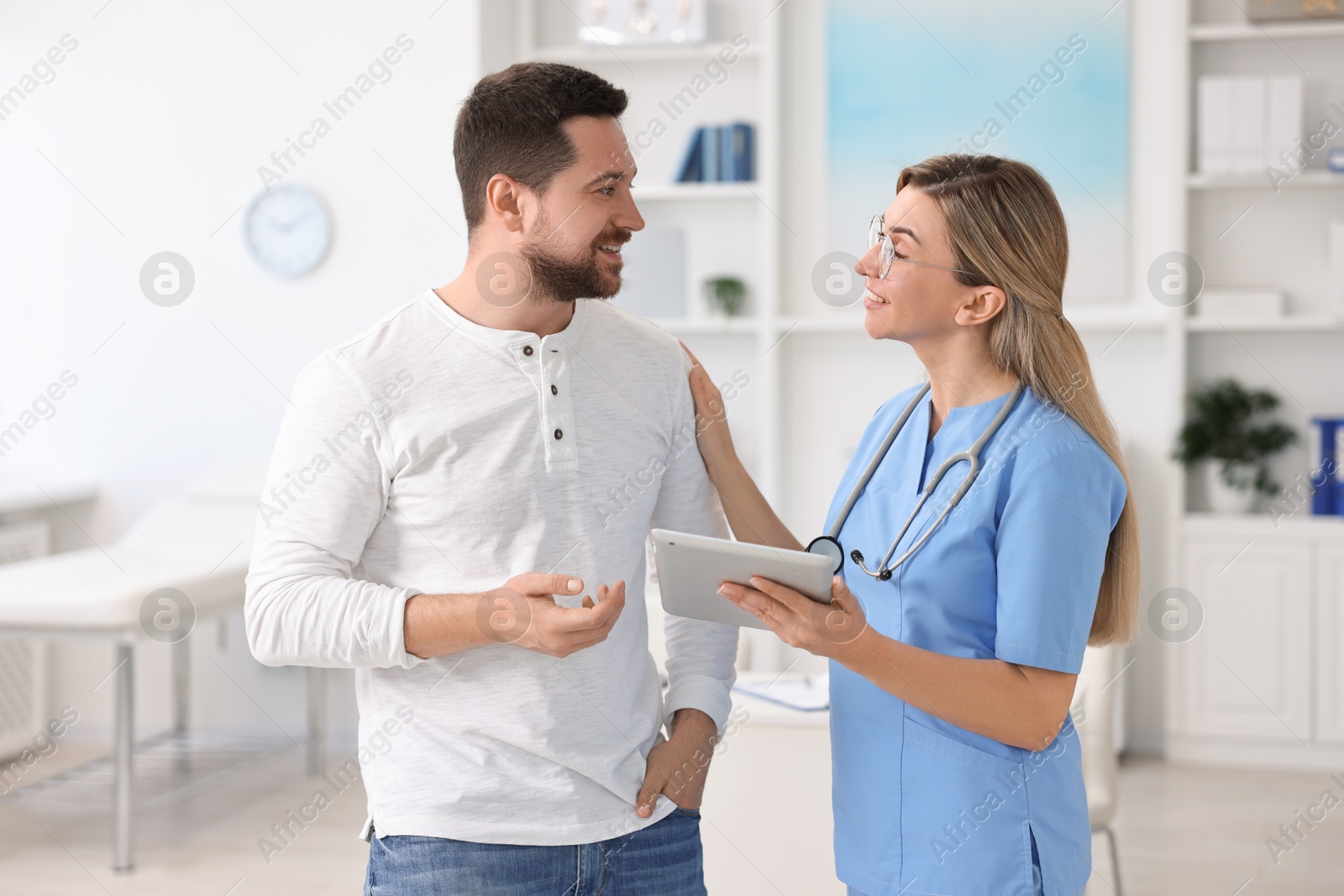 Photo of Professional doctor working with patient in hospital