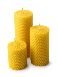 Photo of Stylish elegant beeswax candles isolated on white
