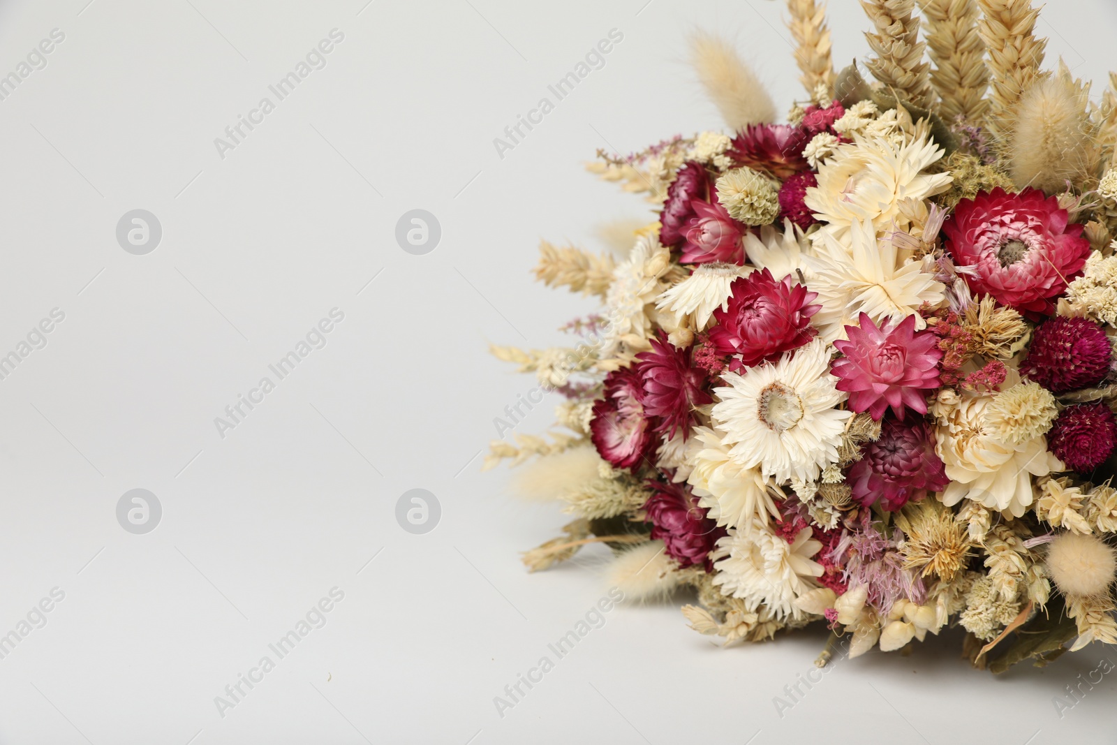 Photo of Beautiful bouquet of dry flowers on white background, space for text