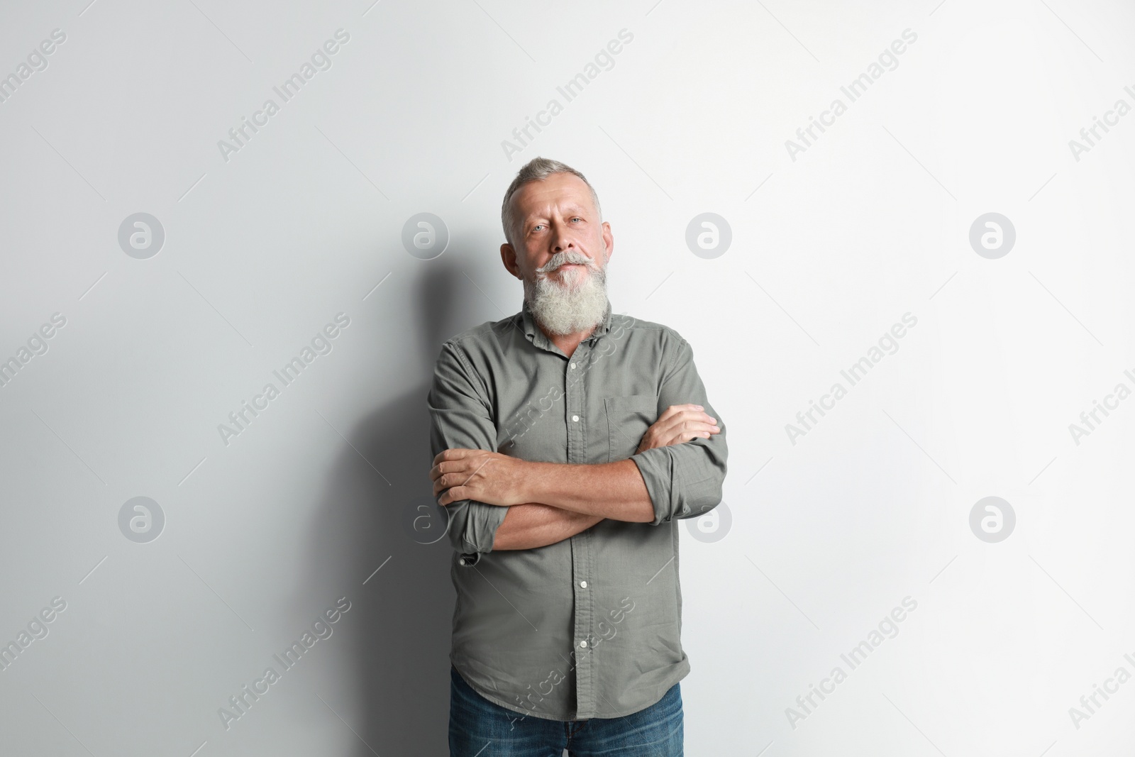 Photo of Portrait of handsome senior man on white background