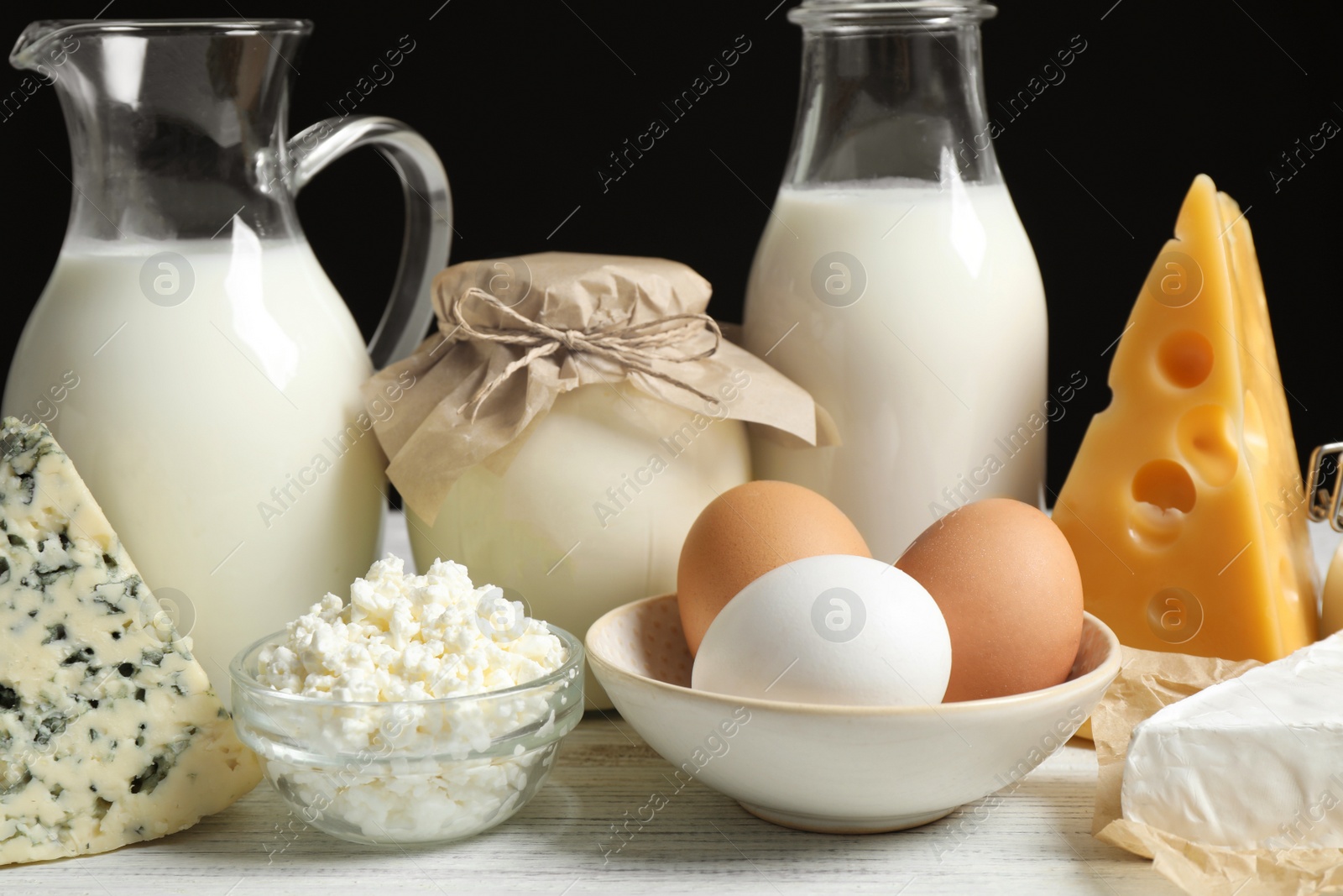 Photo of Different dairy products on white table, closeup