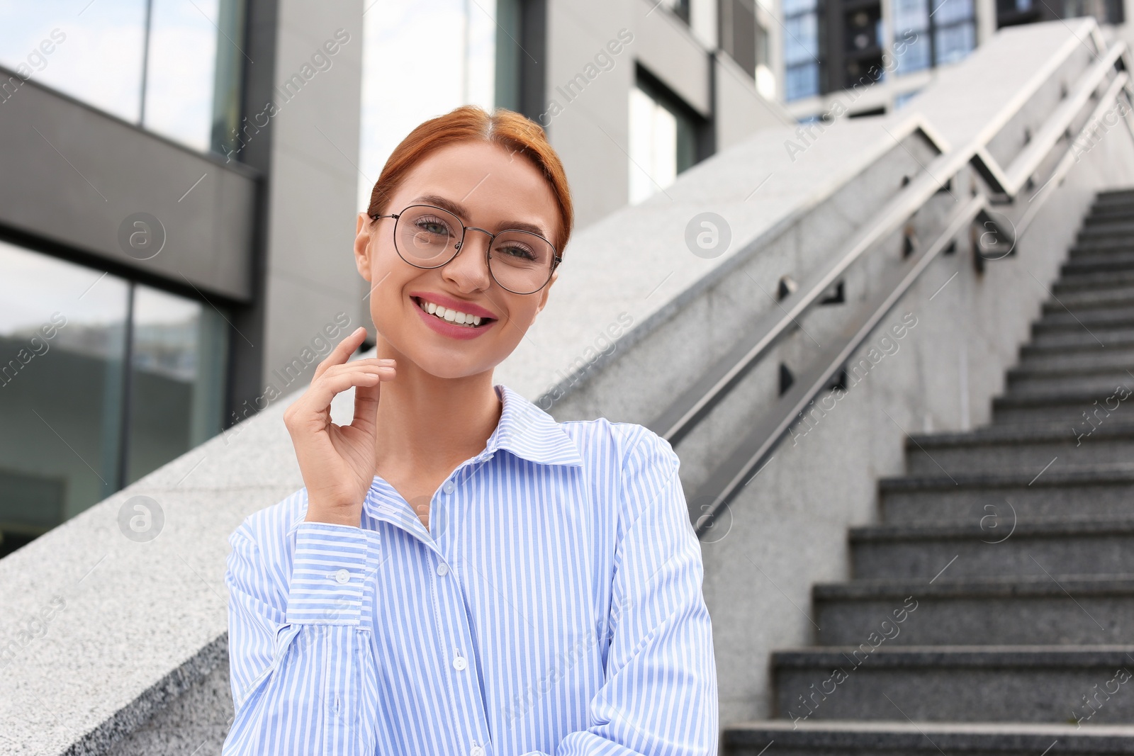 Photo of Portrait of beautiful woman in glasses outdoors, space for text