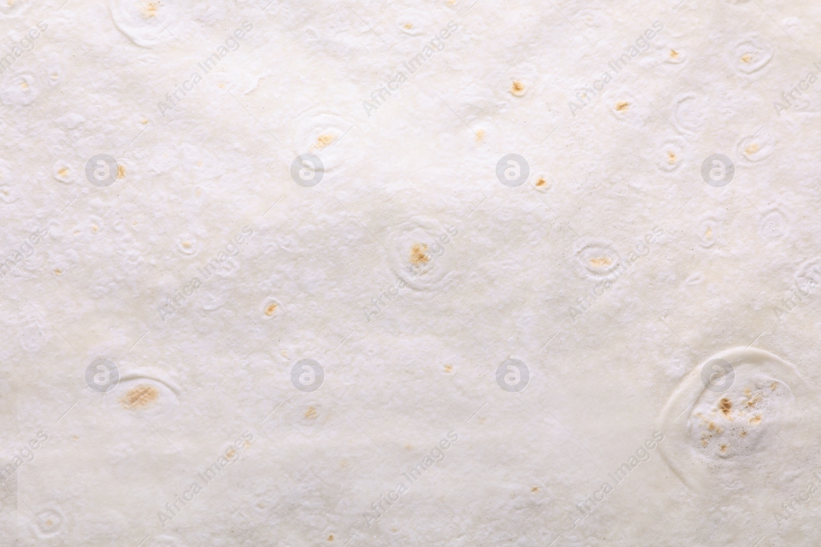 Photo of Texture of thin Armenian lavash as background, top view