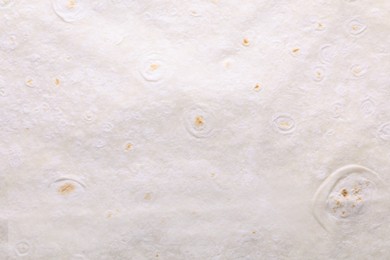 Texture of thin Armenian lavash as background, top view