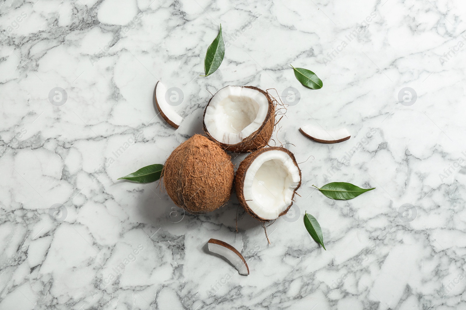 Photo of Flat lay composition with coconuts on marble  table