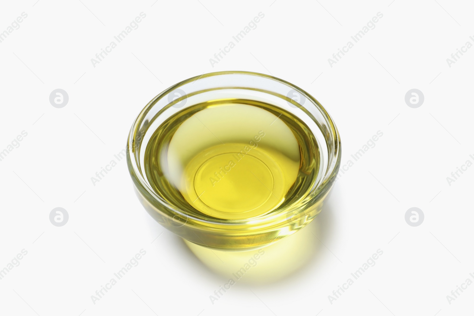 Photo of Little bowl with fresh olive oil on white background