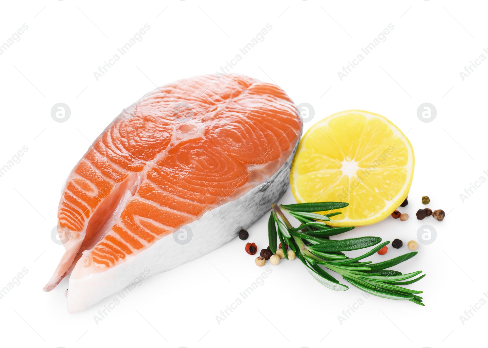 Photo of Fresh raw salmon steak with rosemary, peppercorns and lemon on white background