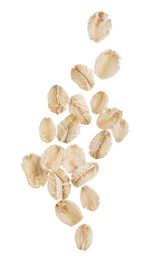 Dry oat flakes falling on white background