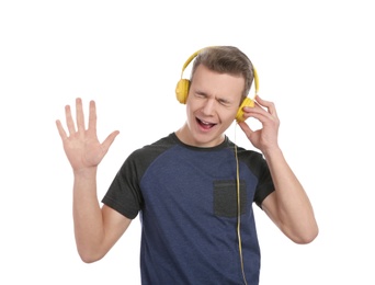 Photo of Teen boy listening to music with headphones on white background