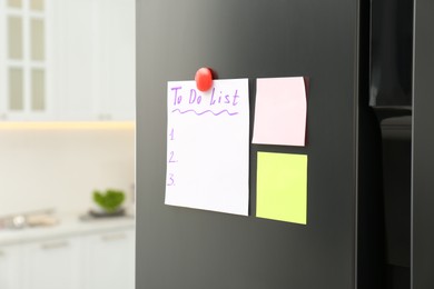 Photo of Blank To do list and sticky notes on fridge in kitchen. Space for text