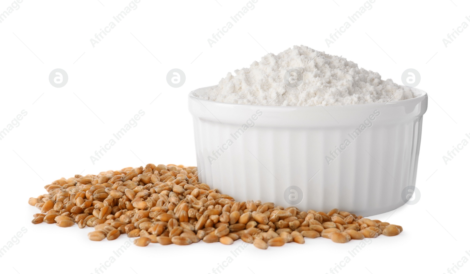 Photo of Bowl with organic flour and grains of wheat on white background