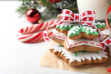 Delicious Christmas cookies on white wooden table