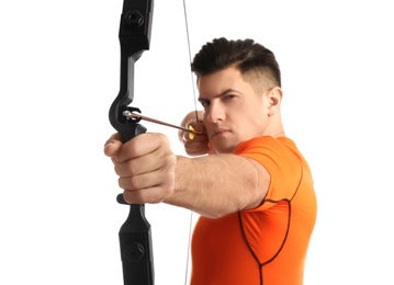 Man with bow and arrow practicing archery against white background, focus on hand