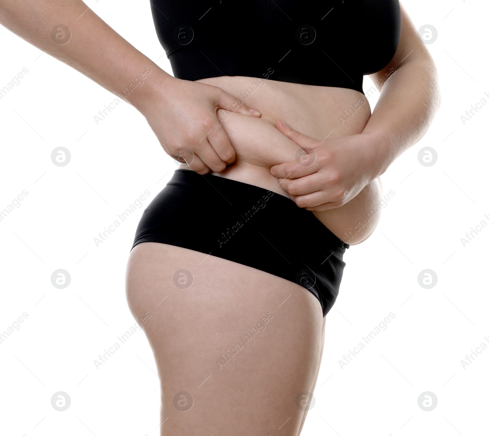 Photo of Woman touching belly fat on white background, closeup. Overweight problem