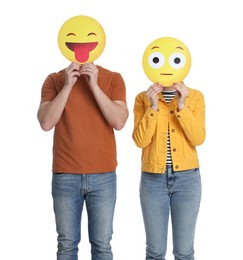 Photo of People covering faces with emoticons on white background