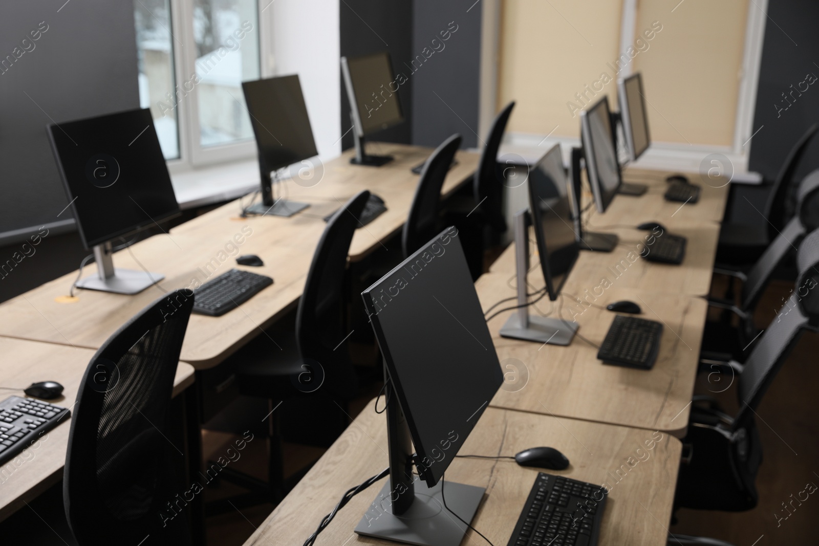 Photo of Many modern computers in open space office