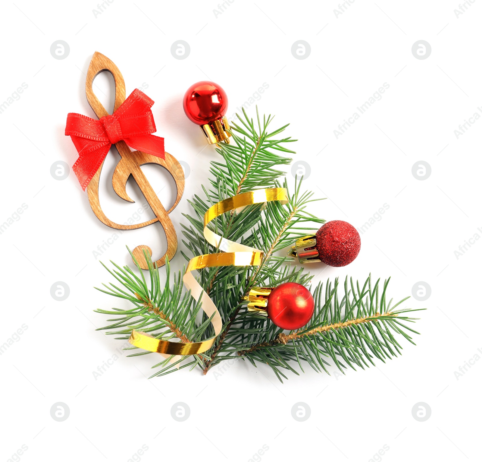 Photo of Wooden treble clef and decorations on white background. Christmas music concept