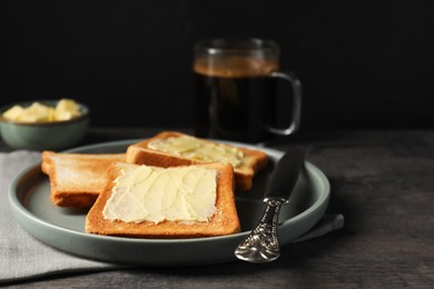 Delicious toasts served with butter and coffee on grey wooden table