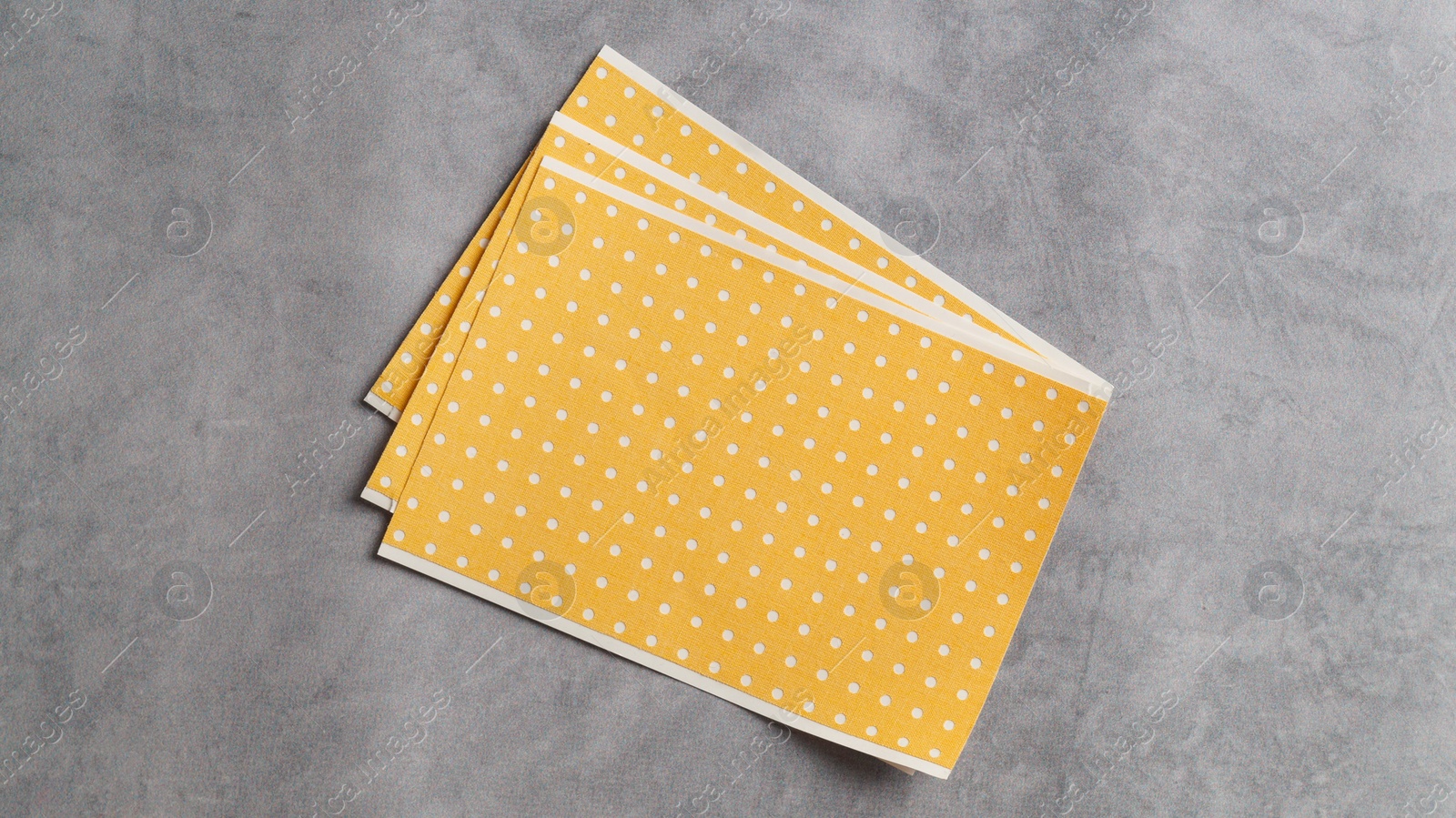 Photo of Pepper plasters on grey textured background, top view