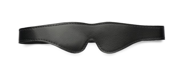 Photo of Black leather eye mask on white background, top view. Accessory for sexual roleplay