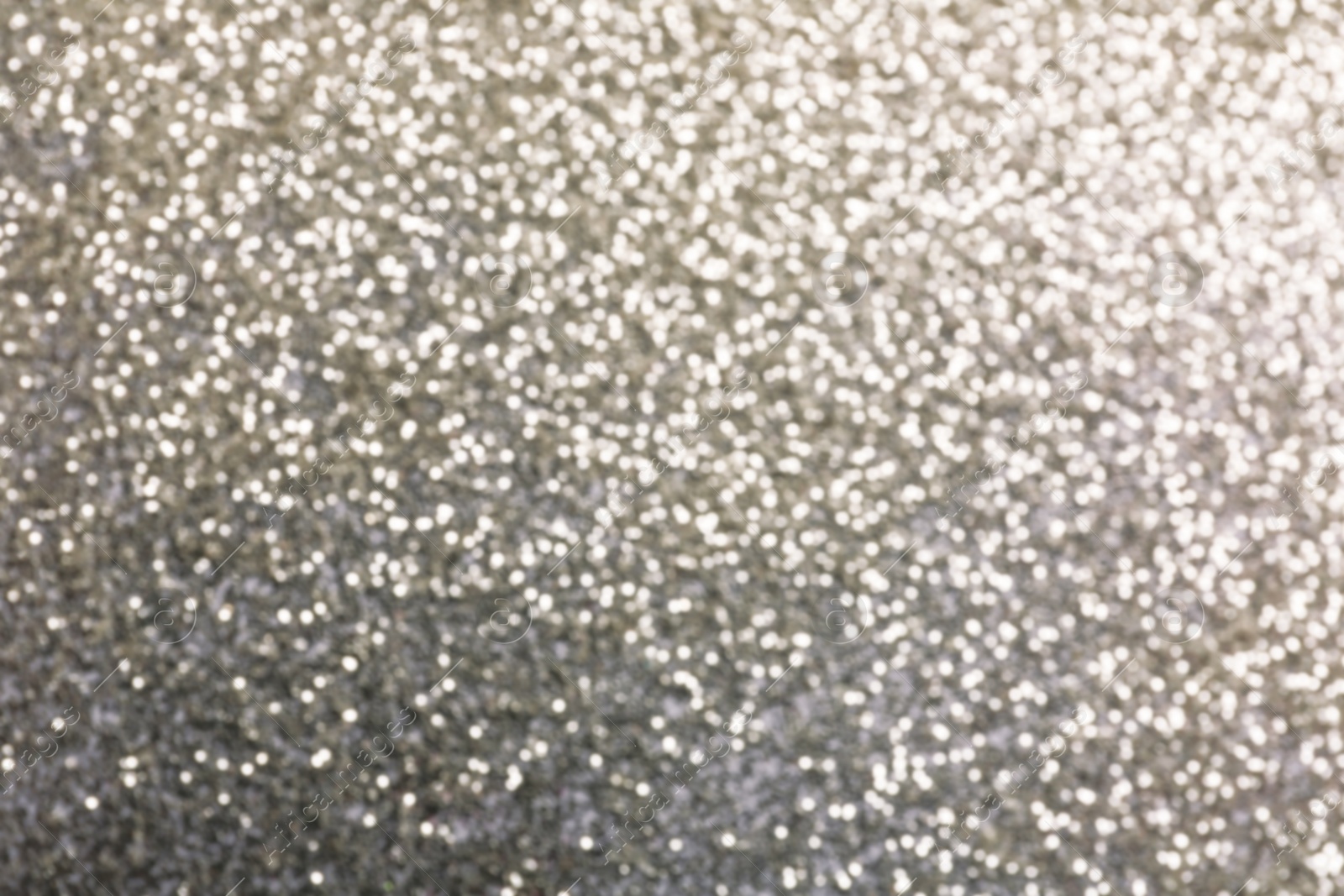 Photo of Closeup view of sparkling silver glitter background