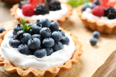 Photo of Tart with blueberries, closeup view. Delicious pastries