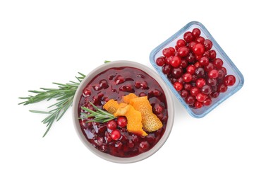 Photo of Fresh cranberry sauce, rosemary, berries and orange peel isolated on white, top view